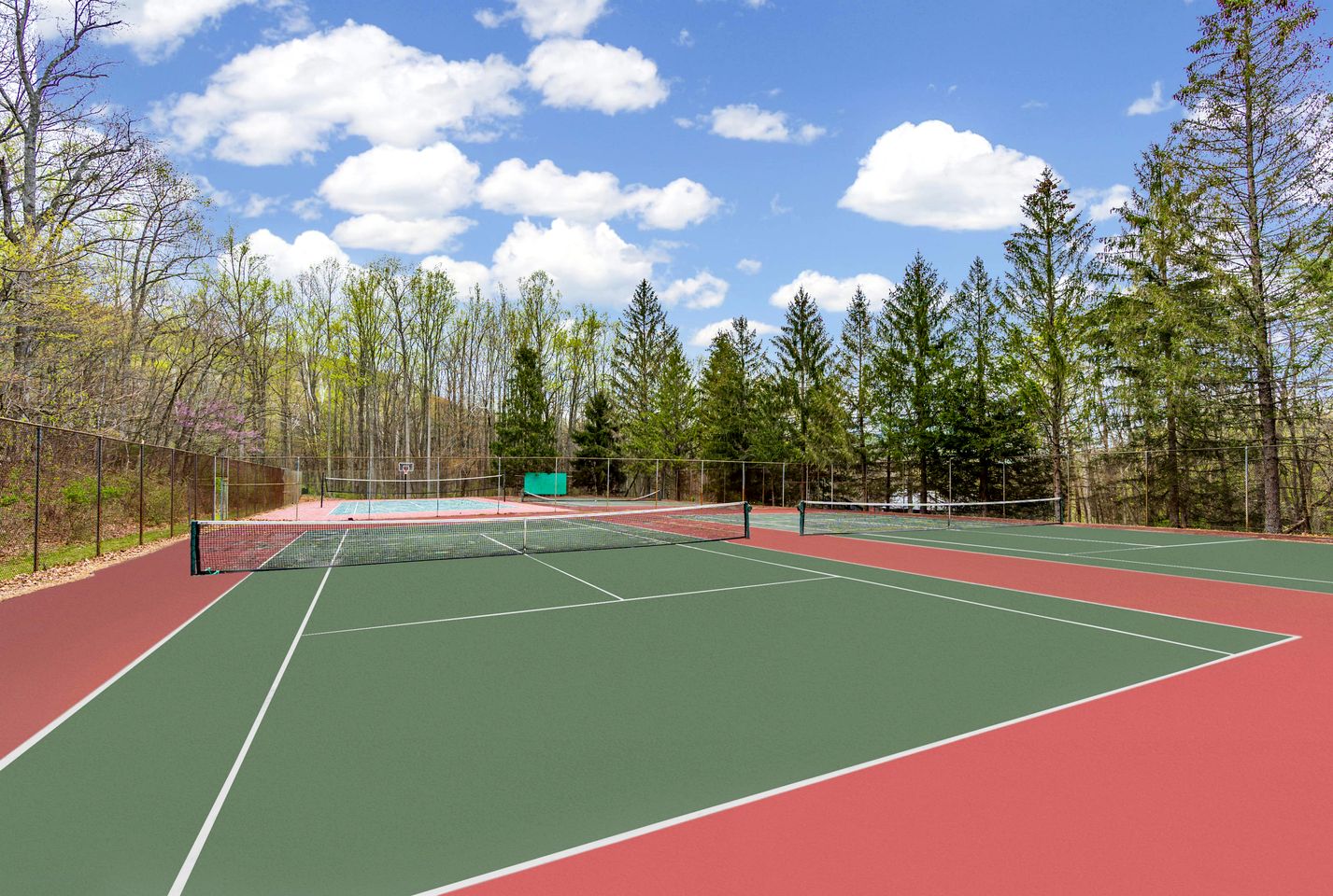 Spacious Cabin Retreat with Hot Tub, Fire Pit, Large Deck and Access to Community Pool and Other Amenities at this Berekely Springs, WV Getaway