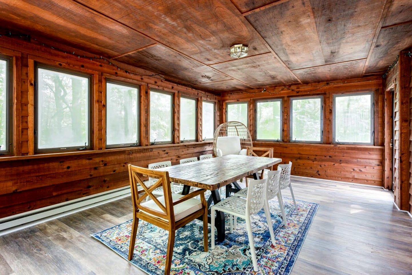 Spacious Cabin Retreat with Hot Tub, Fire Pit, Large Deck and Access to Community Pool and Other Amenities at this Berekely Springs, WV Getaway