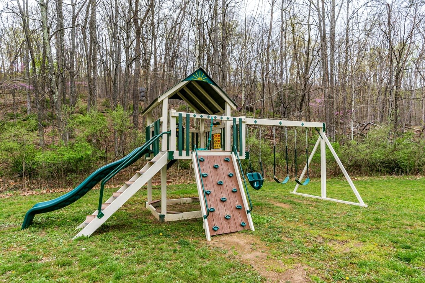 Spacious Cabin Retreat with Hot Tub, Fire Pit, Large Deck and Access to Community Pool and Other Amenities at this Berekely Springs, WV Getaway