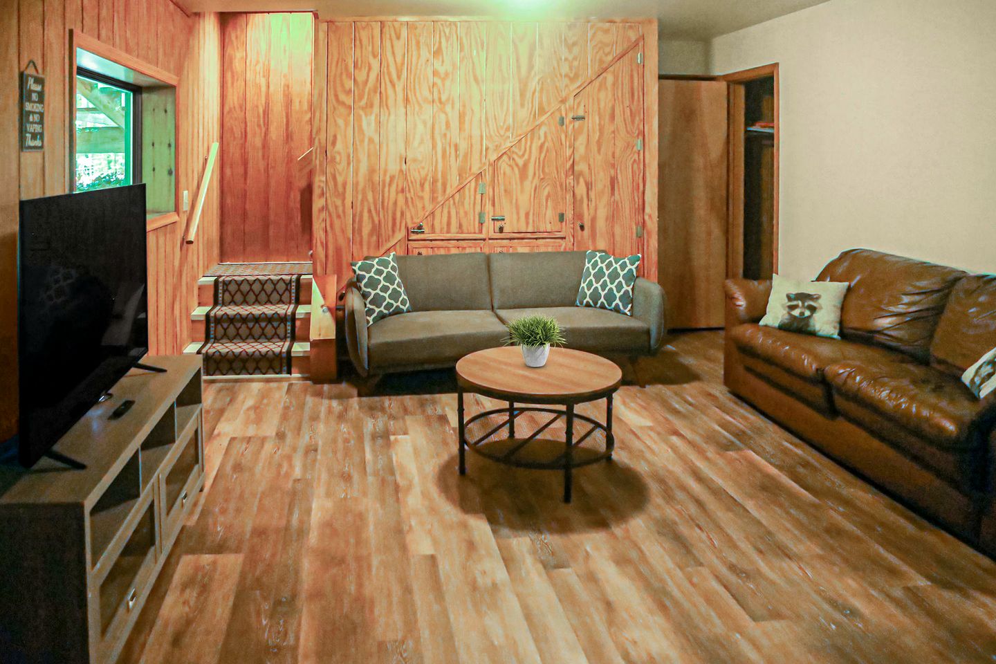 Spacious Cabin Retreat with Hot Tub, Fire Pit, Large Deck and Access to Community Pool and Other Amenities at this Berekely Springs, WV Getaway