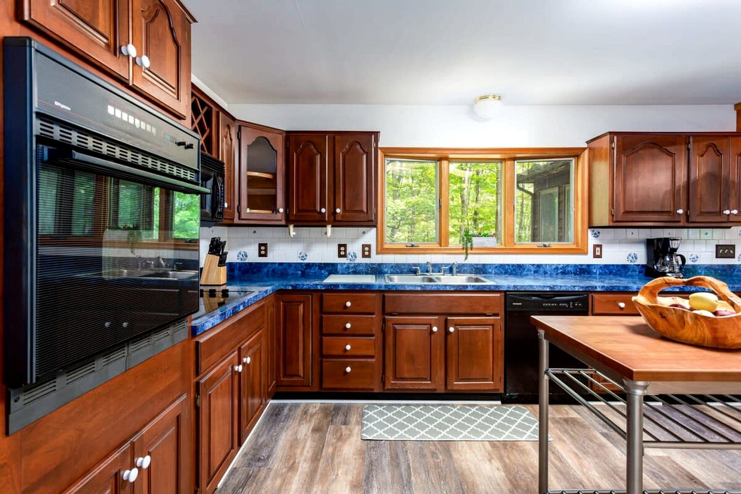 Spacious Cabin Retreat with Hot Tub, Fire Pit, Large Deck and Access to Community Pool and Other Amenities at this Berekely Springs, WV Getaway