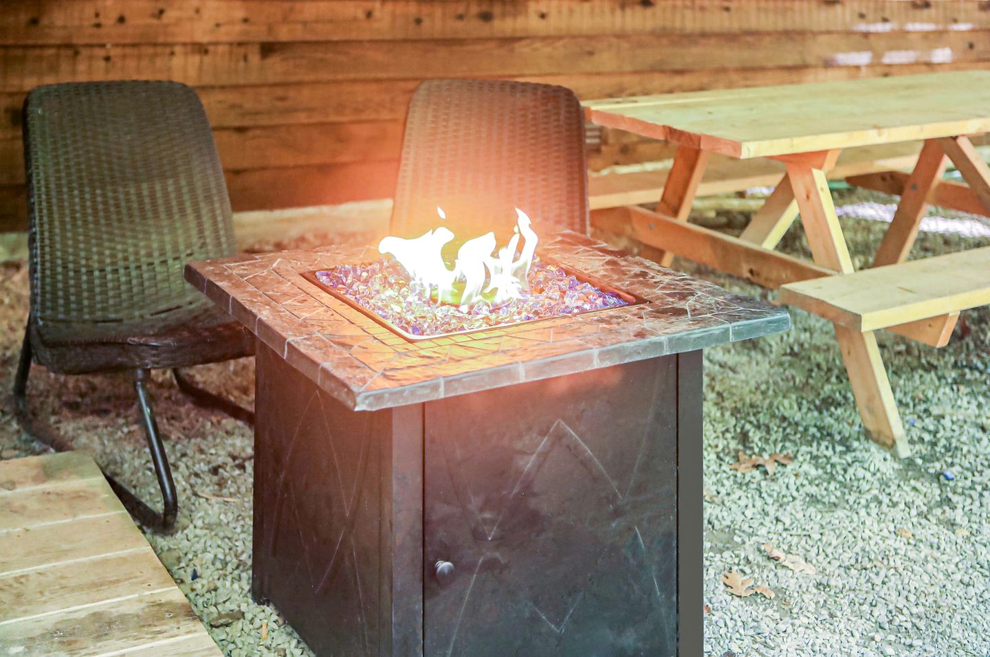 Spacious Cabin Retreat with Hot Tub, Fire Pit, Large Deck and Access to Community Pool and Other Amenities at this Berekely Springs, WV Getaway