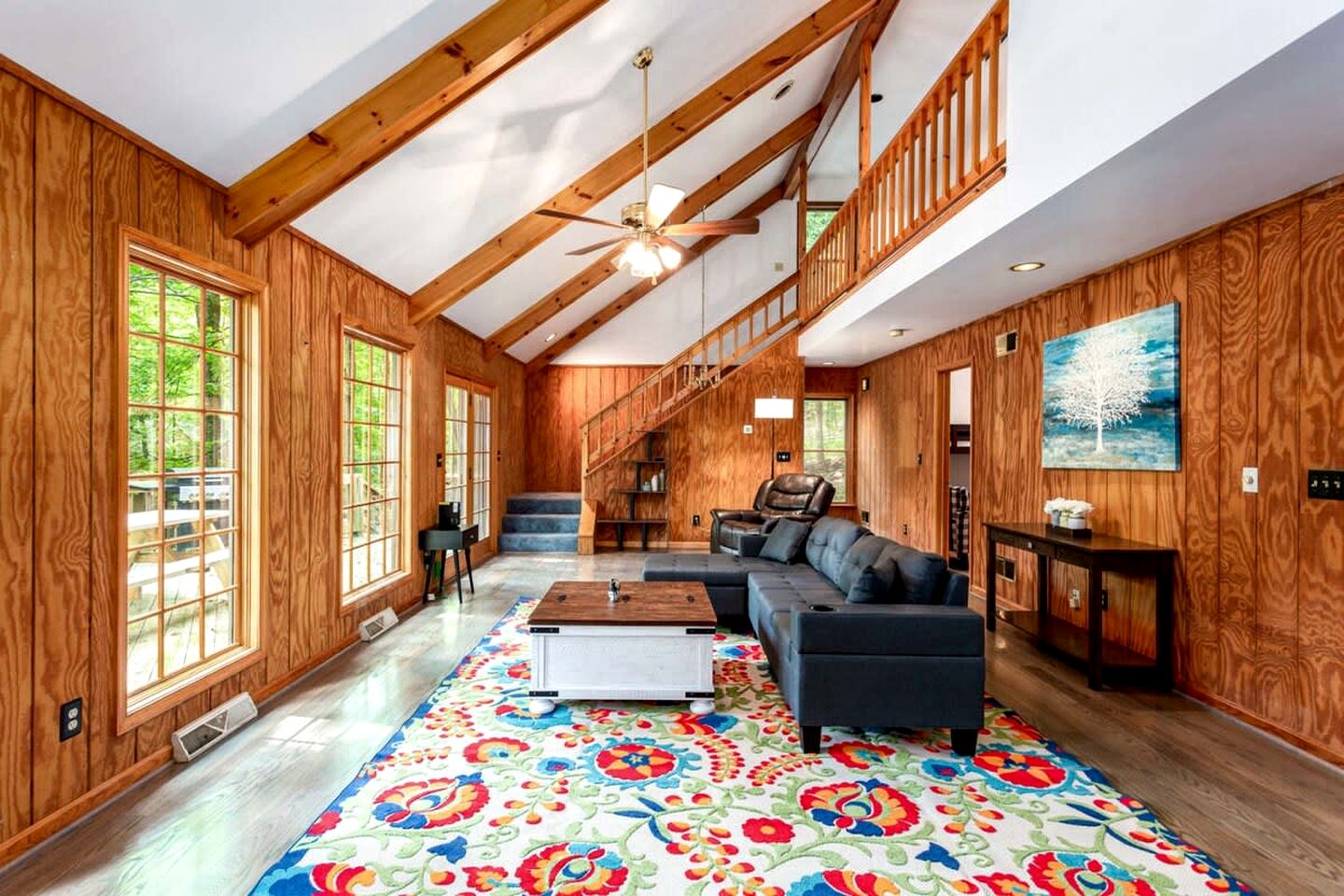 Spacious Cabin Retreat with Hot Tub, Fire Pit, Large Deck and Access to Community Pool and Other Amenities at this Berekely Springs, WV Getaway