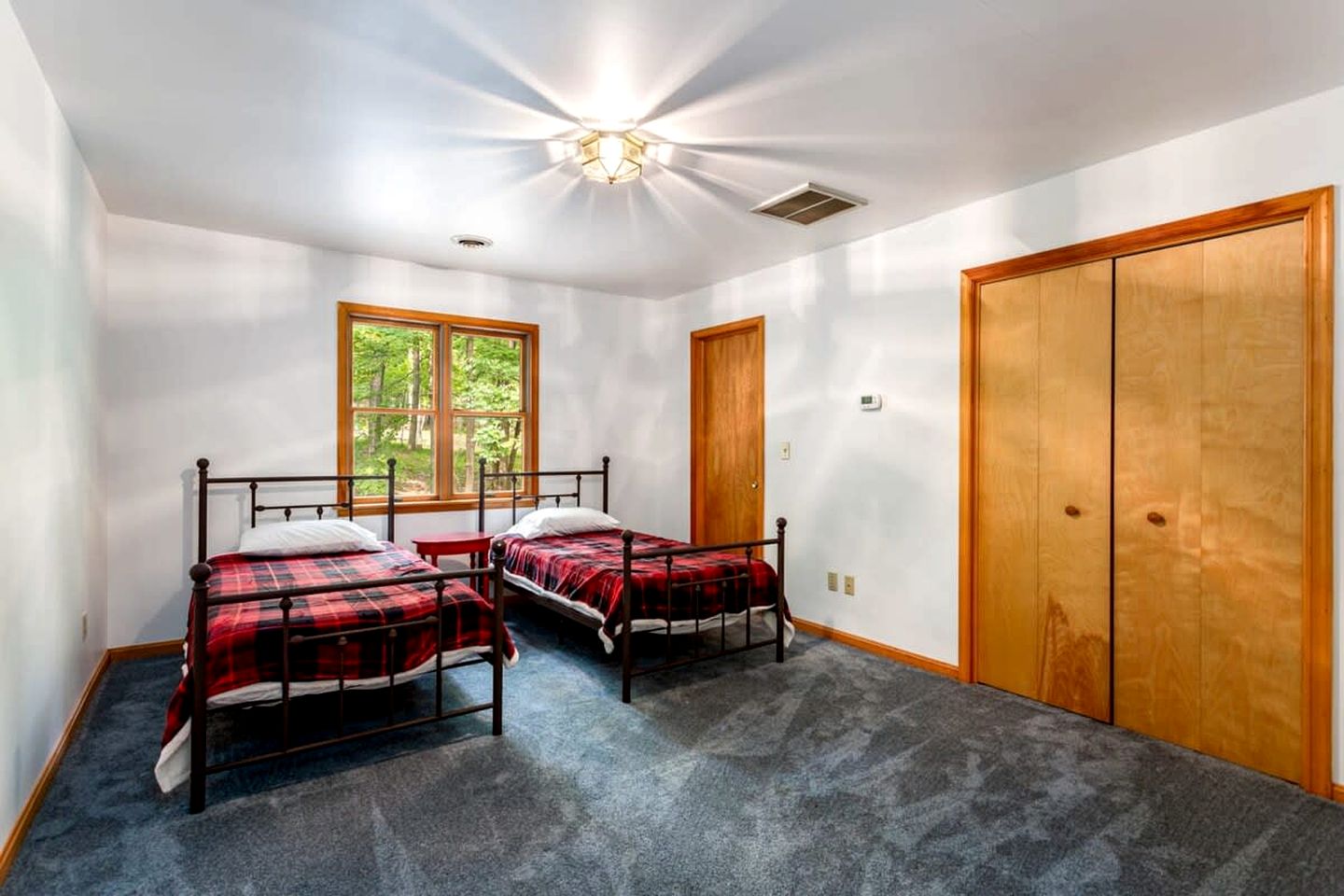 Spacious Cabin Retreat with Hot Tub, Fire Pit, Large Deck and Access to Community Pool and Other Amenities at this Berekely Springs, WV Getaway