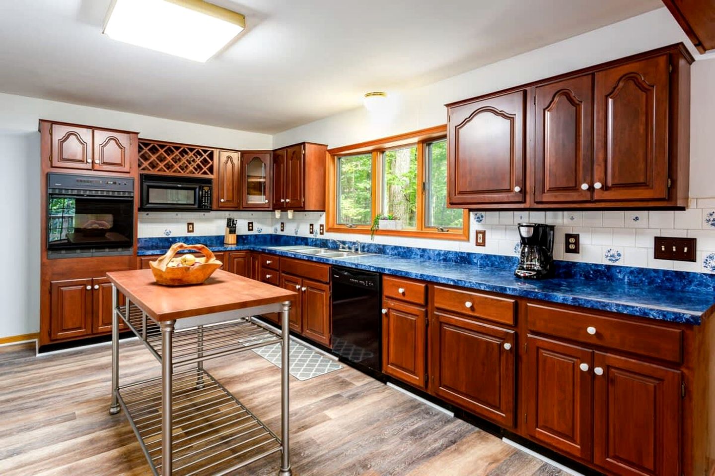 Spacious Cabin Retreat with Hot Tub, Fire Pit, Large Deck and Access to Community Pool and Other Amenities at this Berekely Springs, WV Getaway