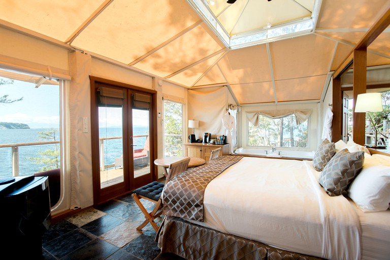 Check out this Rockwater Secret Cove resort! Interior of luxury accommodation looks out on the water