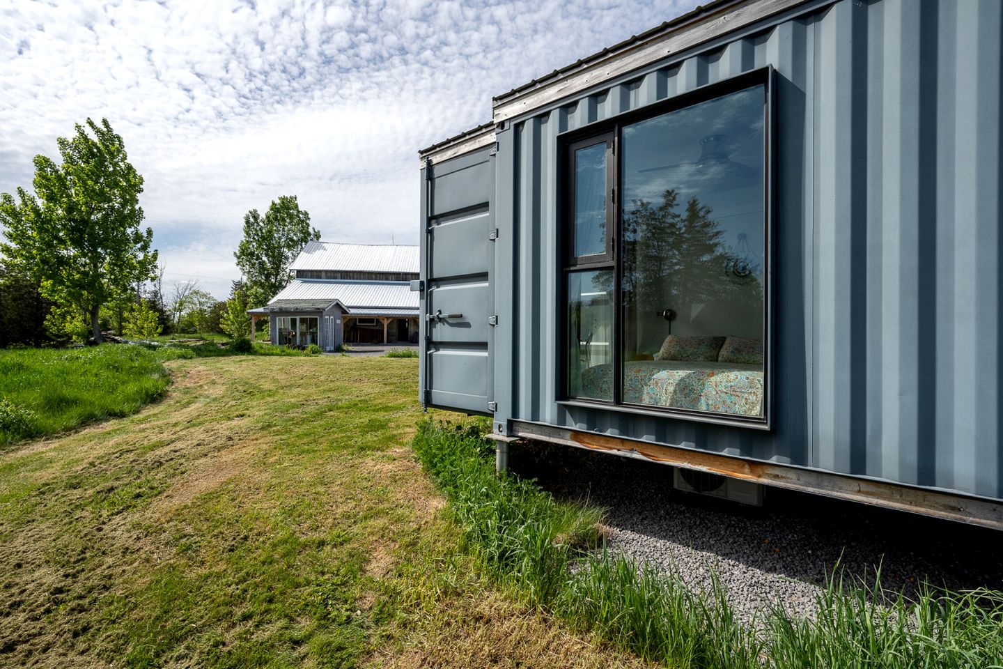 Stylish Modern Shipping Container Retreat with Scenic Meadow Views Near Prince Edward County, Ontario