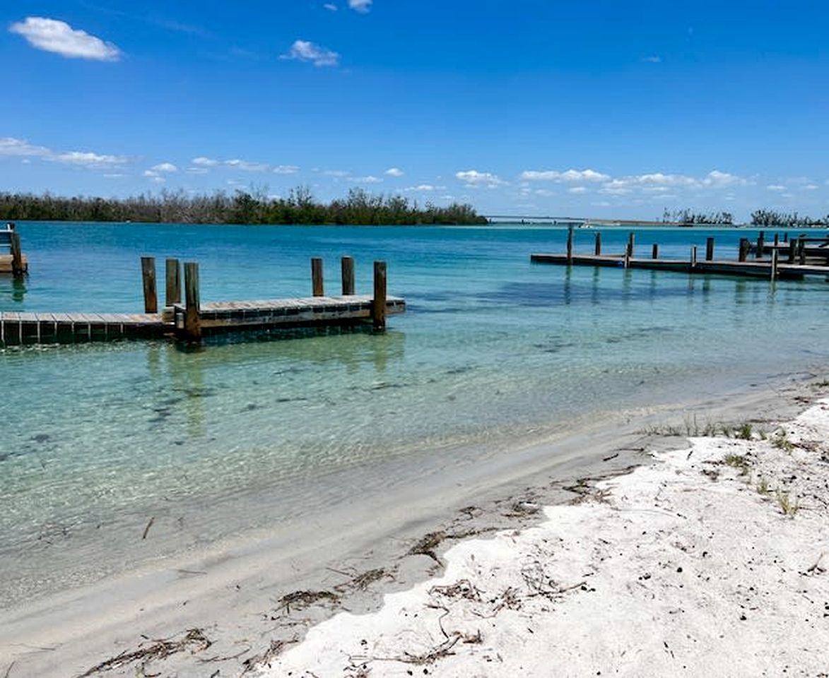 Charming Beachfront Cottage with Private Dock on Little Gasparilla Island, Florida
