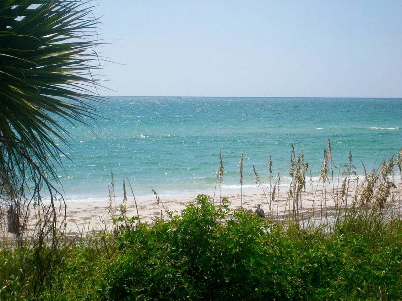 Charming Beachfront Cottage with Private Dock on Little Gasparilla Island, Florida