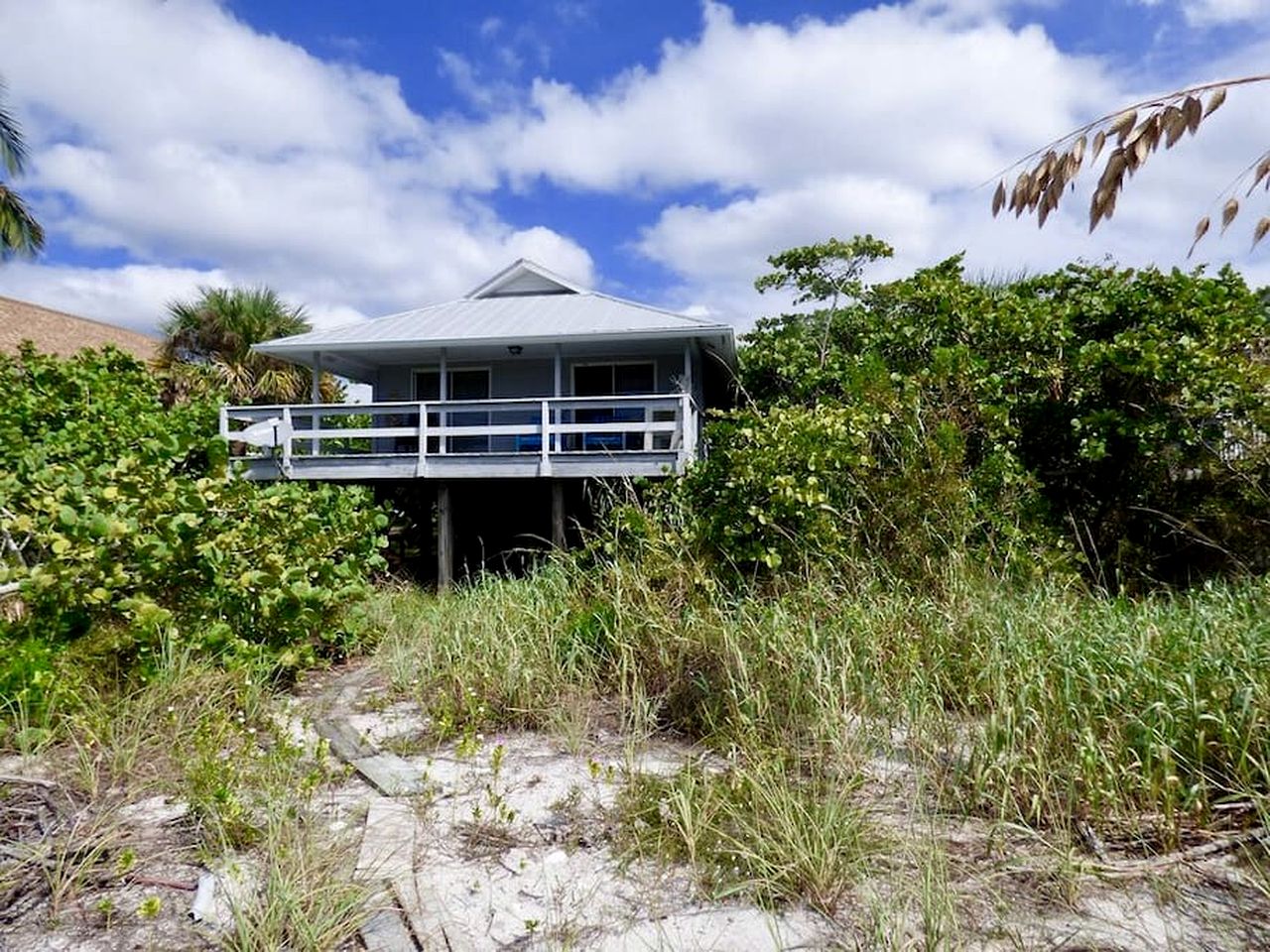 Charming Beachfront Cottage with Private Dock on Little Gasparilla Island, Florida