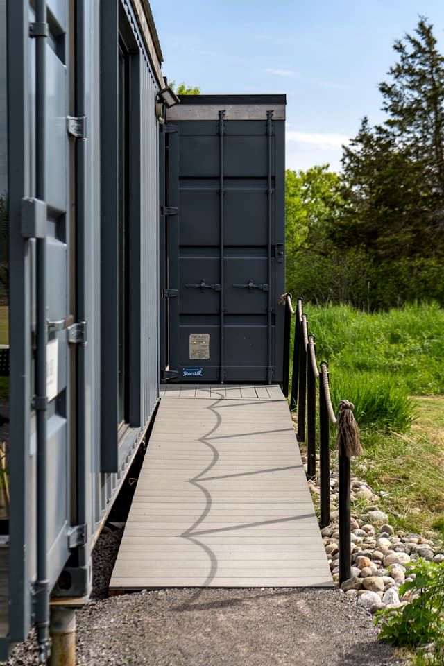 Stylish Shipping Container Retreat with Barn Lounge near Picton, Prince Edward County