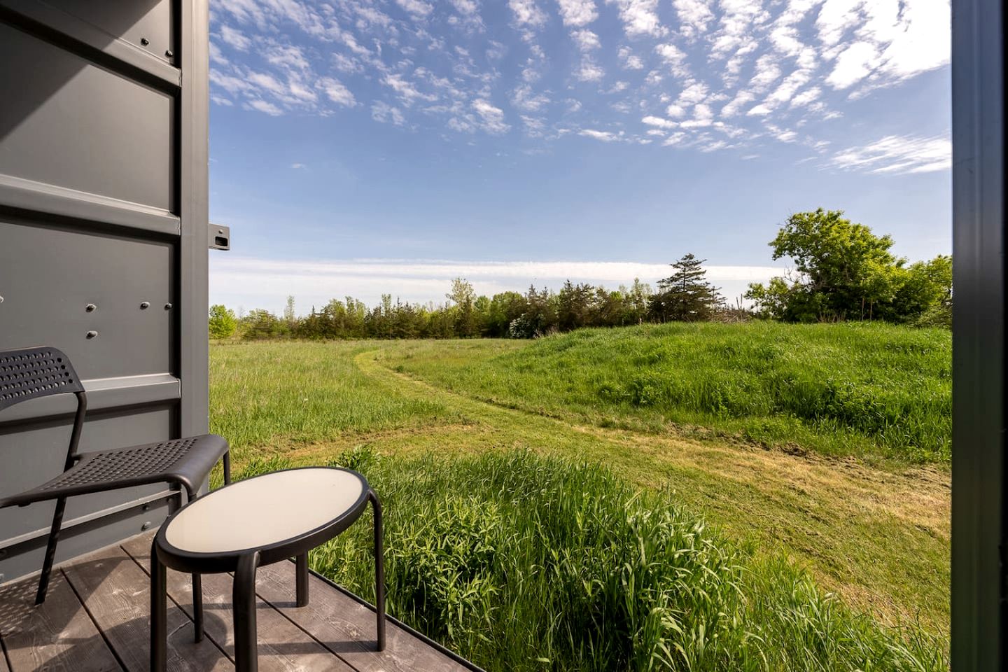 Stylish Modern Shipping Container Retreat with Scenic Meadow Views Near Prince Edward County, Ontario