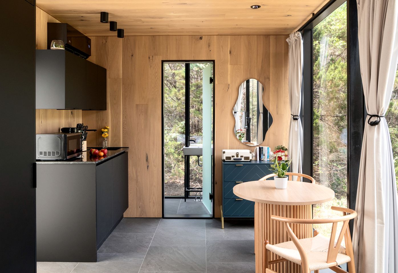 Whimsical Flower-Inspired Mirror Cabin by the Lake in the Enchanted Forests of Texas