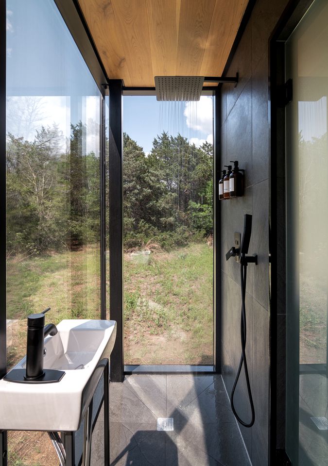 Whimsical Flower-Inspired Mirror Cabin by the Lake in the Enchanted Forests of Texas