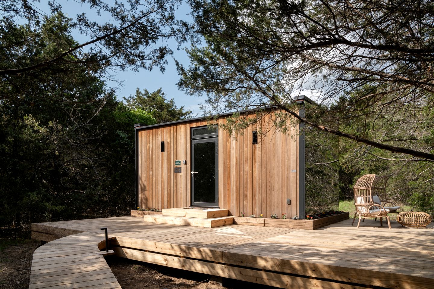 Whimsical Flower-Inspired Mirror Cabin by the Lake in the Enchanted Forests of Texas