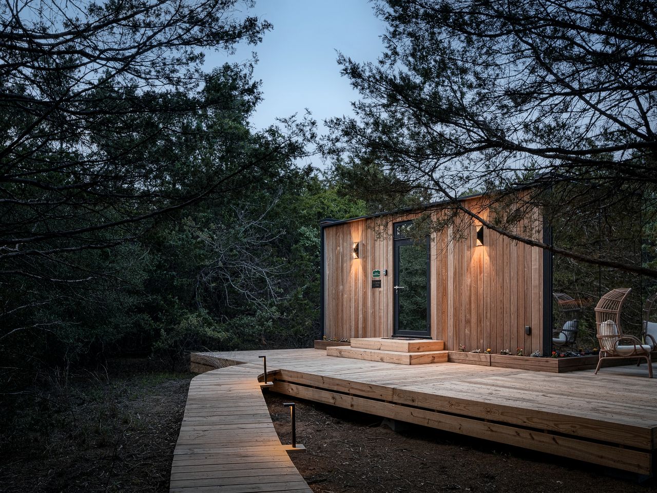 Whimsical Flower-Inspired Mirror Cabin by the Lake in the Enchanted Forests of Texas