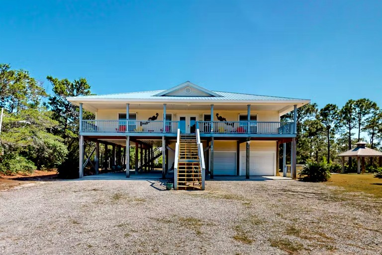 Charming Beachside Home with Private Patio & Dog-Friendly Policy near Surfside Shores, Gulf Shores, AL