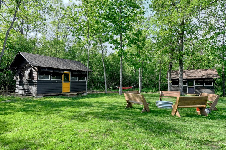 Three Cozy Historic Scout Cabins with Fire Pit, BBQ, and Hammocks for a Memorable Family Adventure in Troy, Wisconsin