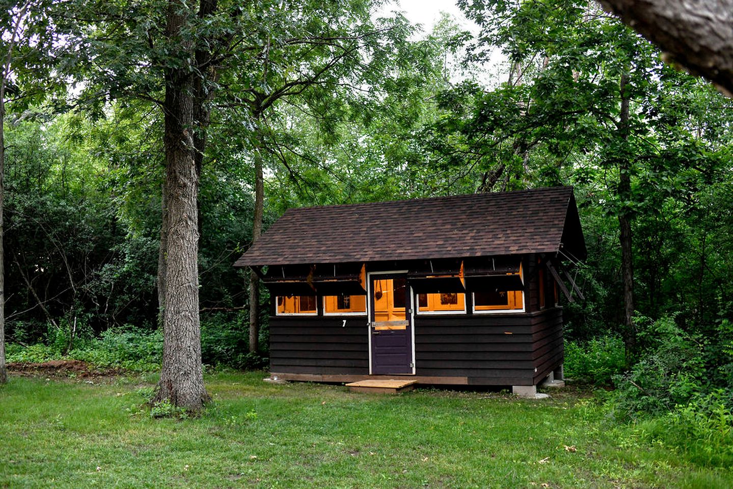 Three Cozy Historic Scout Cabins with Fire Pit, BBQ, and Hammocks for a Memorable Family Adventure in Troy, Wisconsin