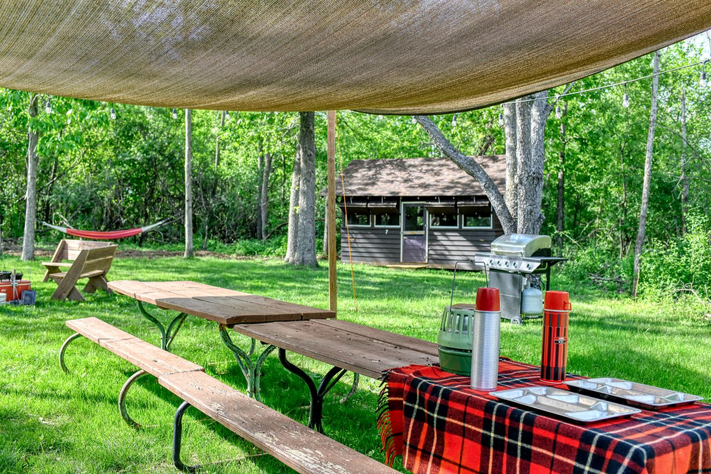 Three Cozy Historic Scout Cabins with Fire Pit, BBQ, and Hammocks for a Memorable Family Adventure in Troy, Wisconsin