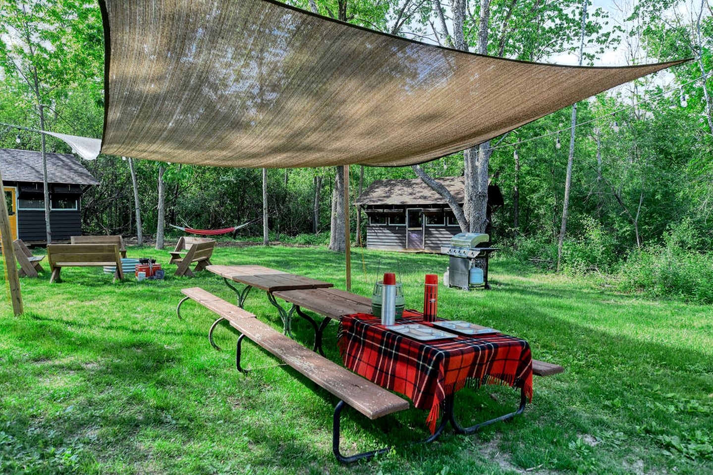 Three Cozy Historic Scout Cabins with Fire Pit, BBQ, and Hammocks for a Memorable Family Adventure in Troy, Wisconsin