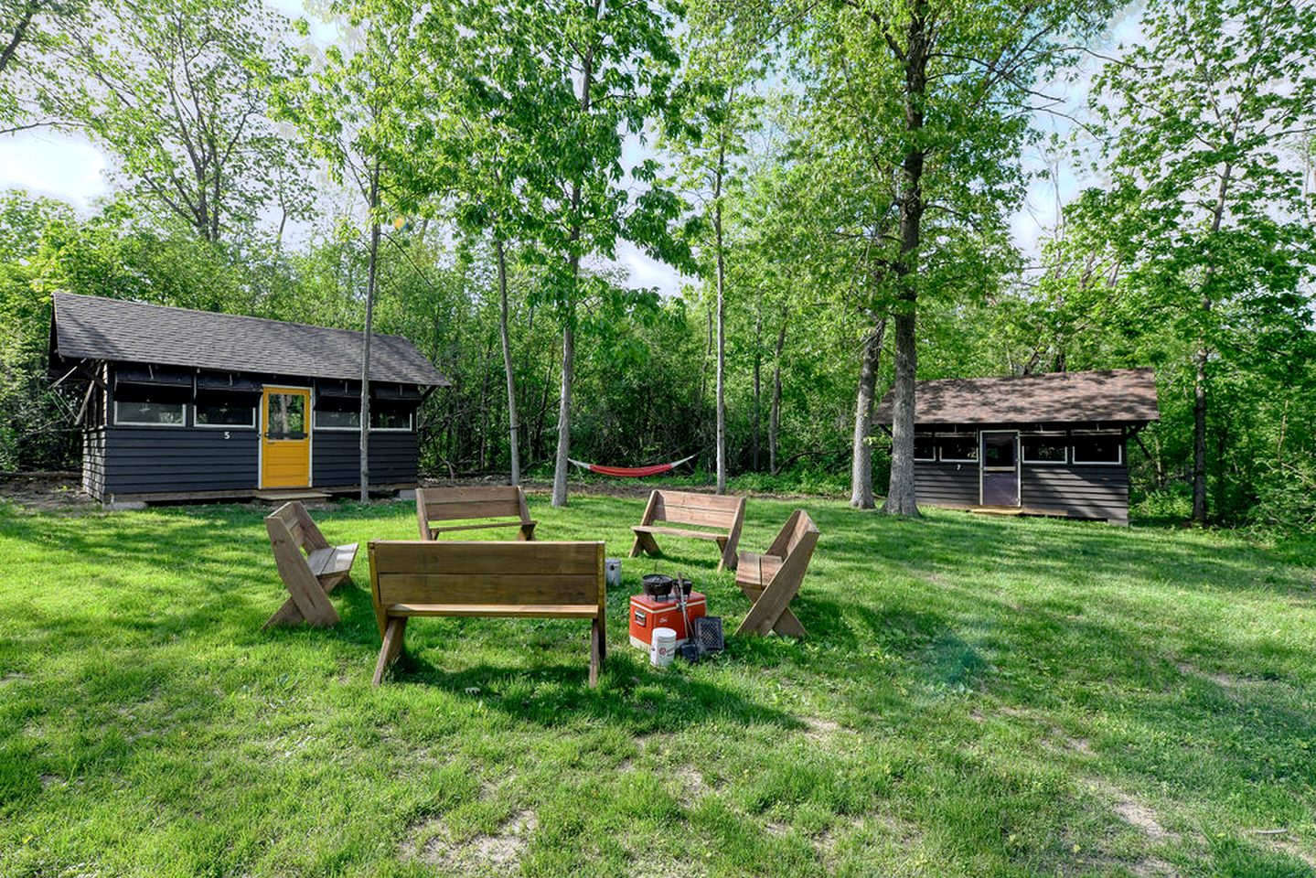 Three Cozy Historic Scout Cabins with Fire Pit, BBQ, and Hammocks for a Memorable Family Adventure in Troy, Wisconsin