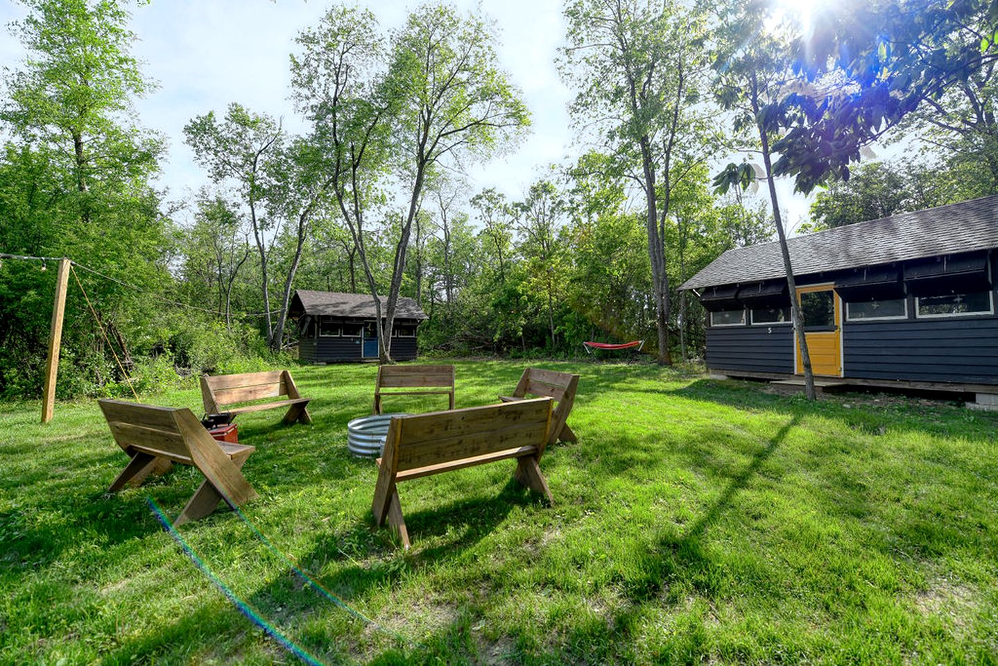 Three Cozy Historic Scout Cabins with Fire Pit, BBQ, and Hammocks for a Memorable Family Adventure in Troy, Wisconsin