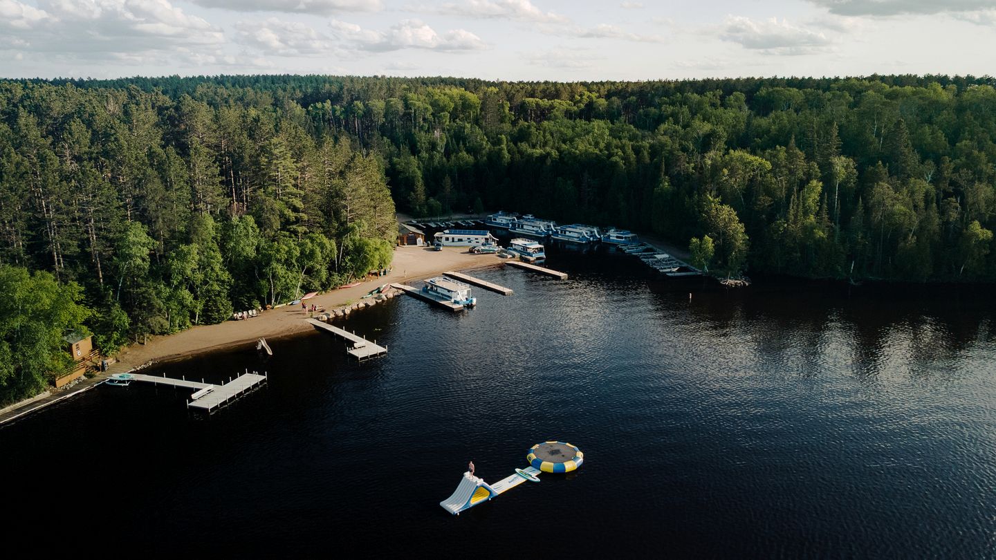 Versatile Sportsman Houseboat with Wraparound Fishing Deck & Water Slide Near Babbitt, MN