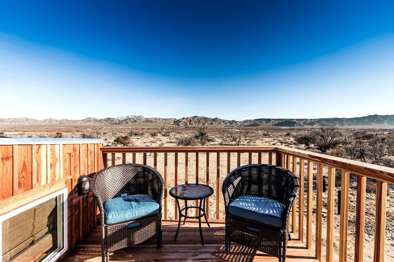 View of the desert from the roof deck of a tiny house rental in Sandy Valley, Nevada.