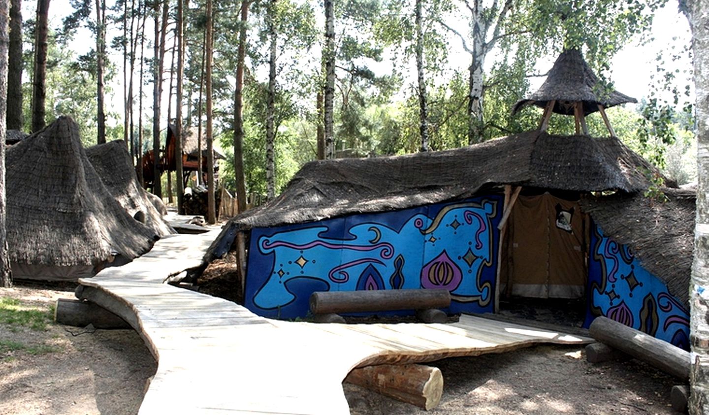 Unique Tents Nestled Below Treehouses in Germany