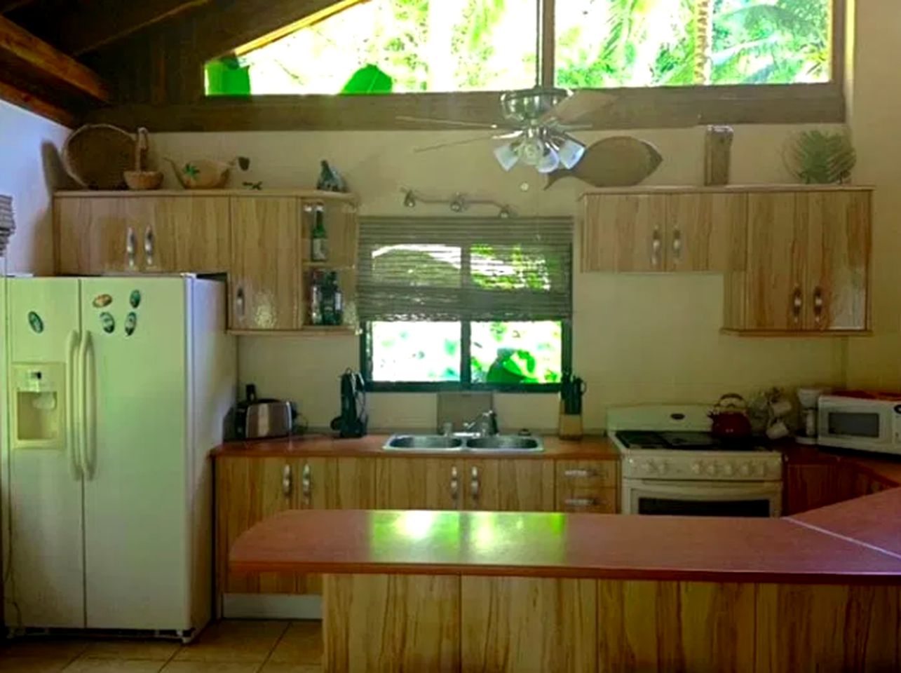 Tranquil Cottage Rental Surrounded by a Palm Garden near Cacao Lagoon, Honduras