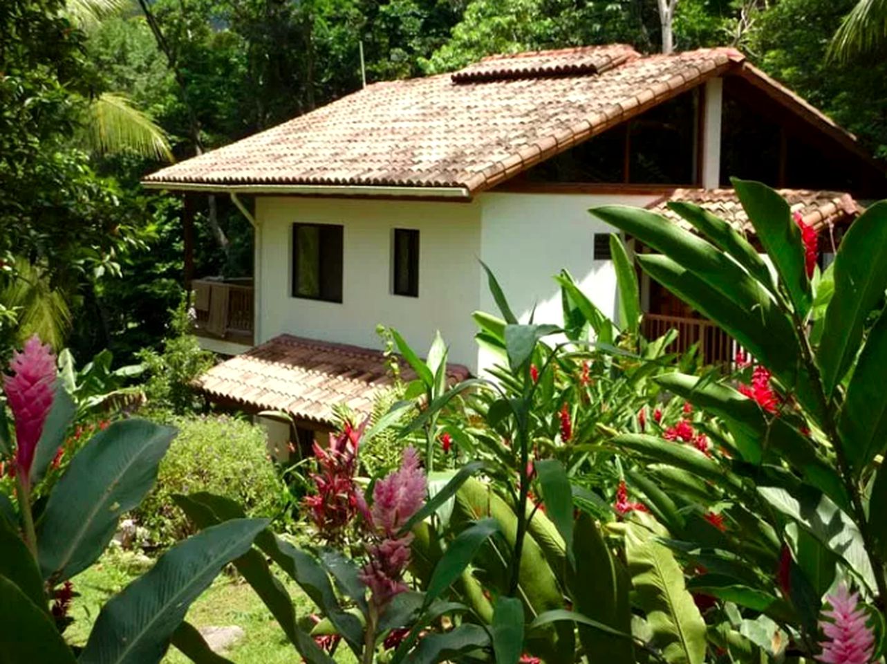 Tranquil Cottage Rental Surrounded by a Palm Garden near Cacao Lagoon, Honduras