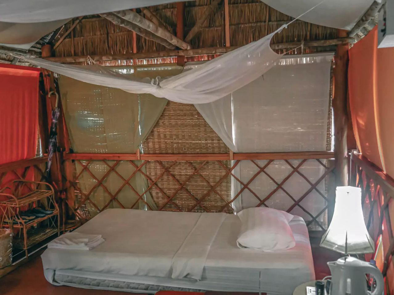 Authentic Elevated Hut Accommodations Surrounded by Trees in Cambodia