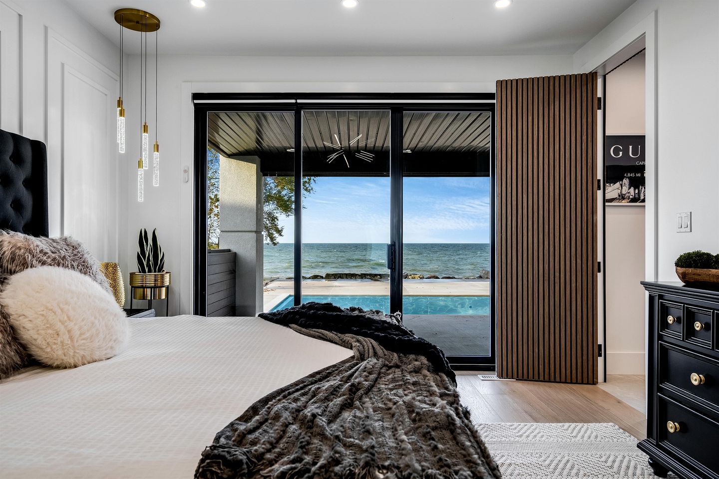 Sophisticated Shoreline Retreat with Sunset Patio & Poolside Lounging in Ontario, Canada