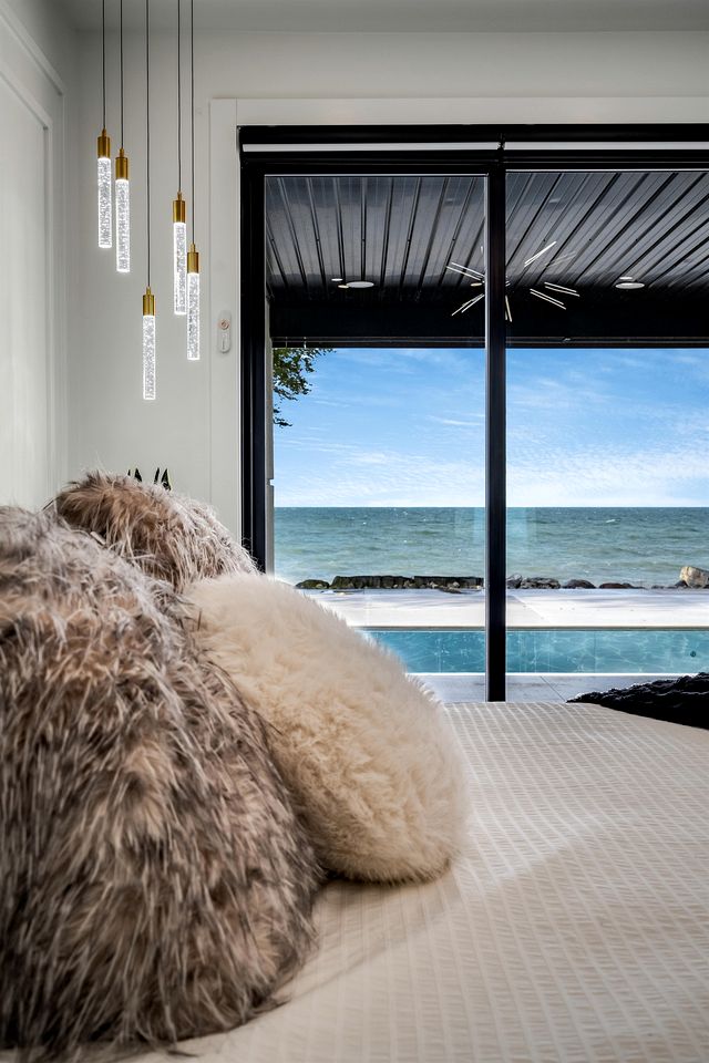 Sophisticated Shoreline Retreat with Sunset Patio & Poolside Lounging in Ontario, Canada