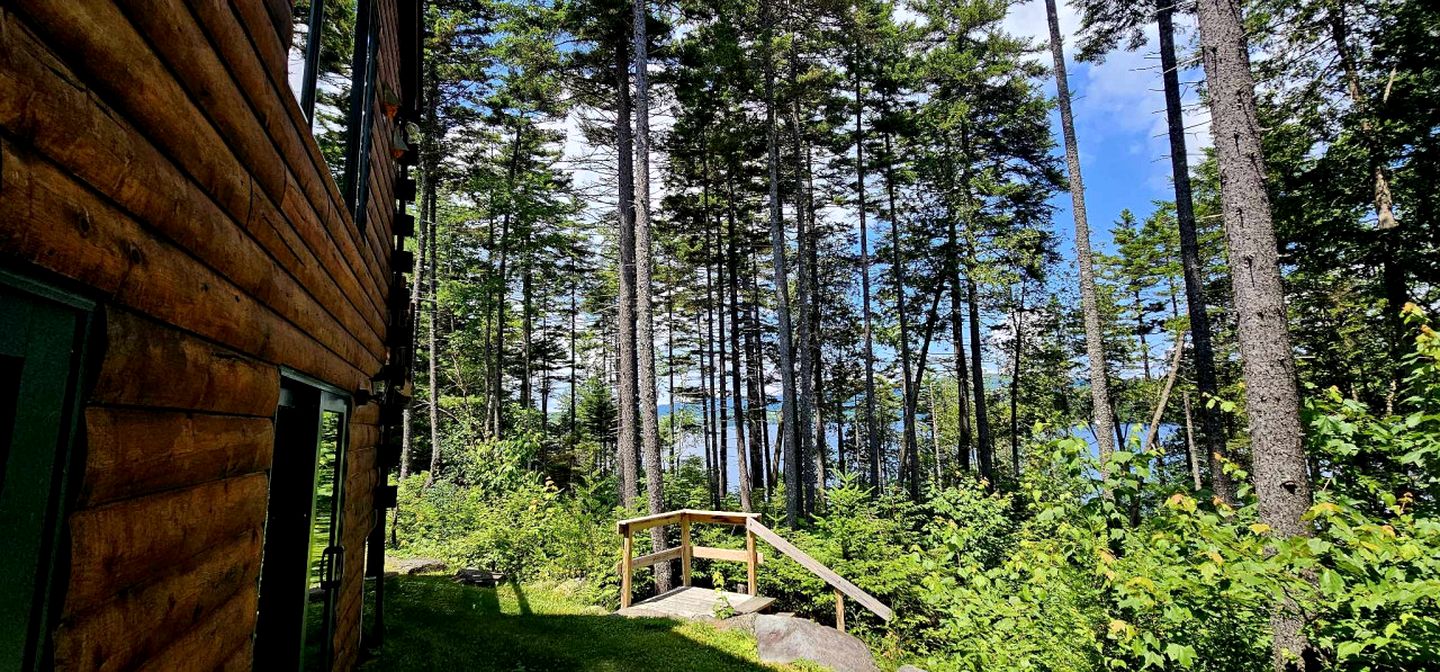 Waterfront Cabin with Private Deck Loaded with Kayaks in Maine