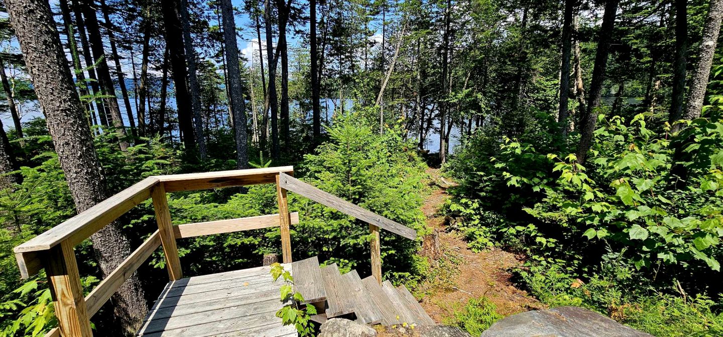 Waterfront Cabin with Private Deck Loaded with Kayaks in Maine