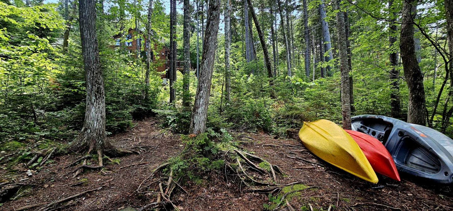 Waterfront Cabin with Private Deck Loaded with Kayaks in Maine