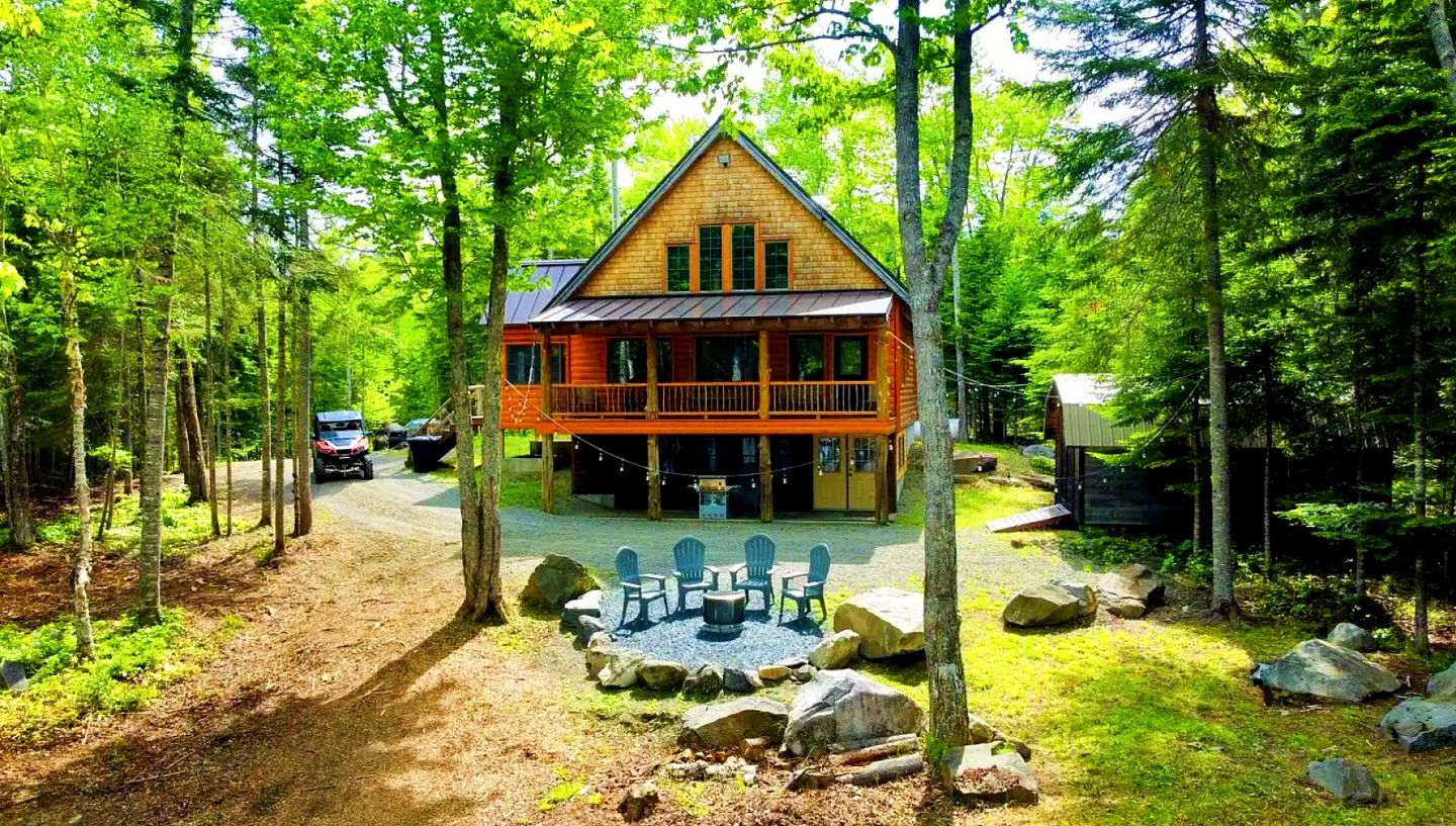 Wooden Lake Cabin Loaded with Kayaks in Maine