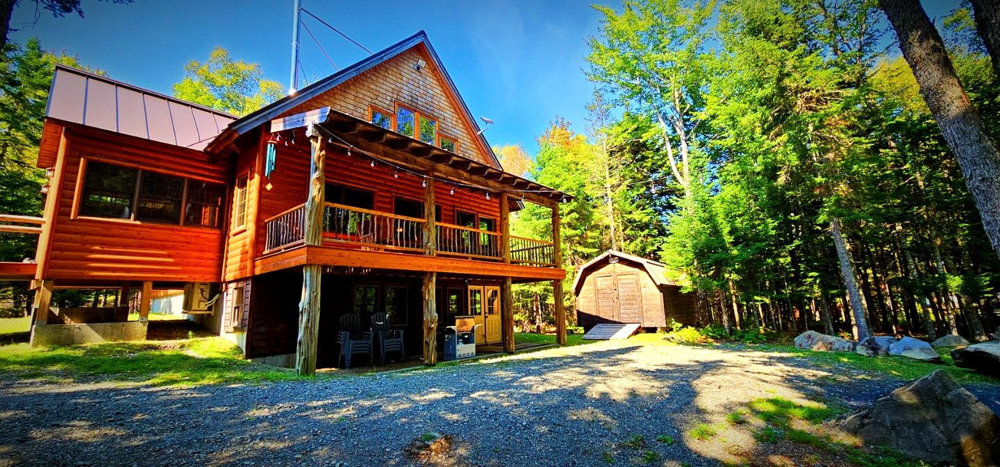 Wooden Lake Cabin Loaded with Kayaks in Maine