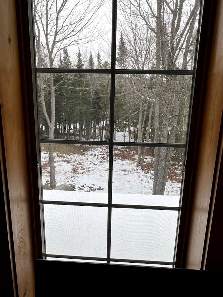 Wooden Lake Cabin Loaded with Kayaks in Maine
