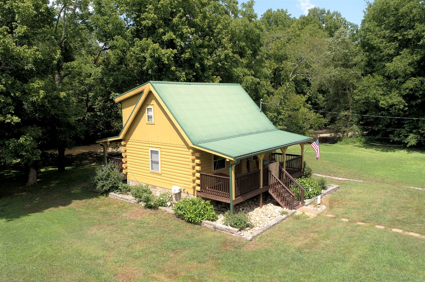 Elevate Your Tennessee Glamping Escape in this Lovely Riverside Cabin Rental in Newport