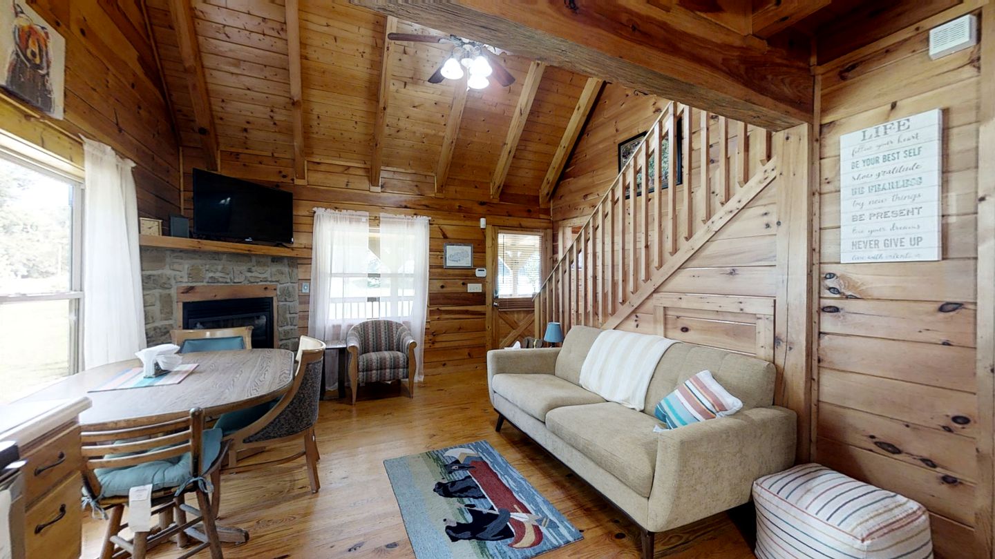 Elevate Your Tennessee Glamping Escape in this Lovely Riverside Cabin Rental in Newport