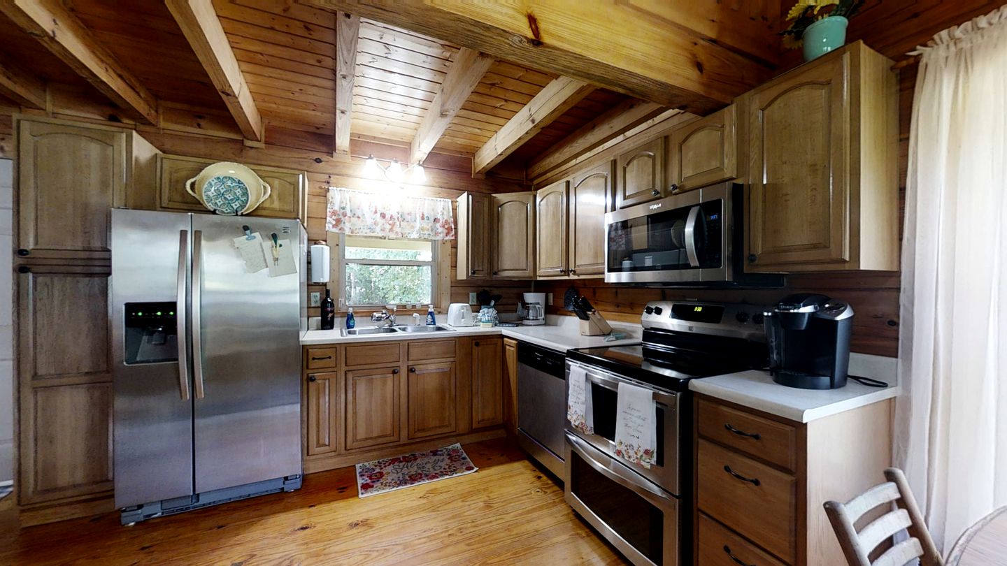 Elevate Your Tennessee Glamping Escape in this Lovely Riverside Cabin Rental in Newport